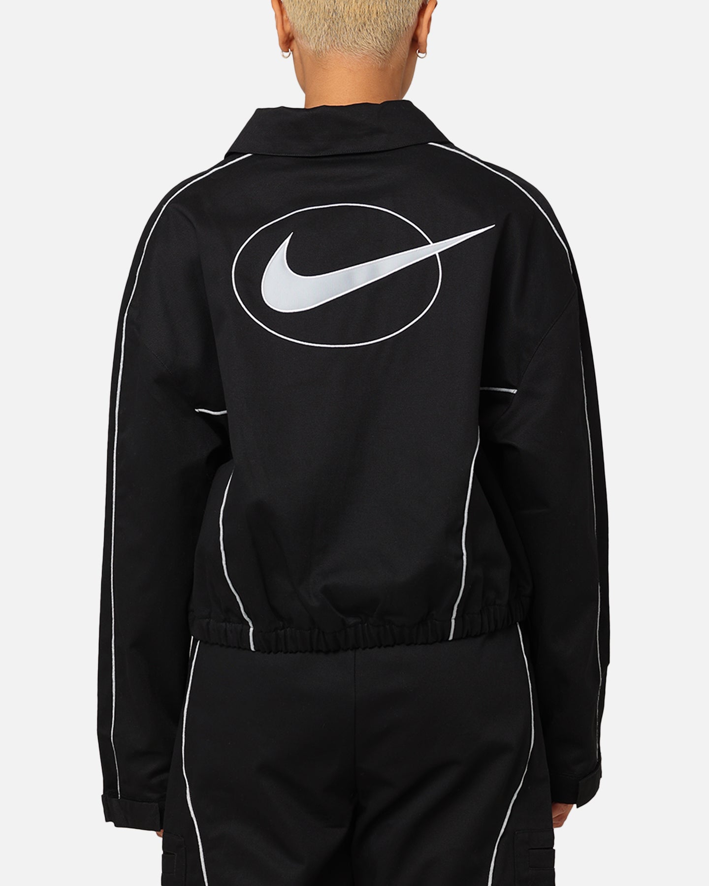 Nike dames sportkledingstraat geweven jas zwart/licht pruimen