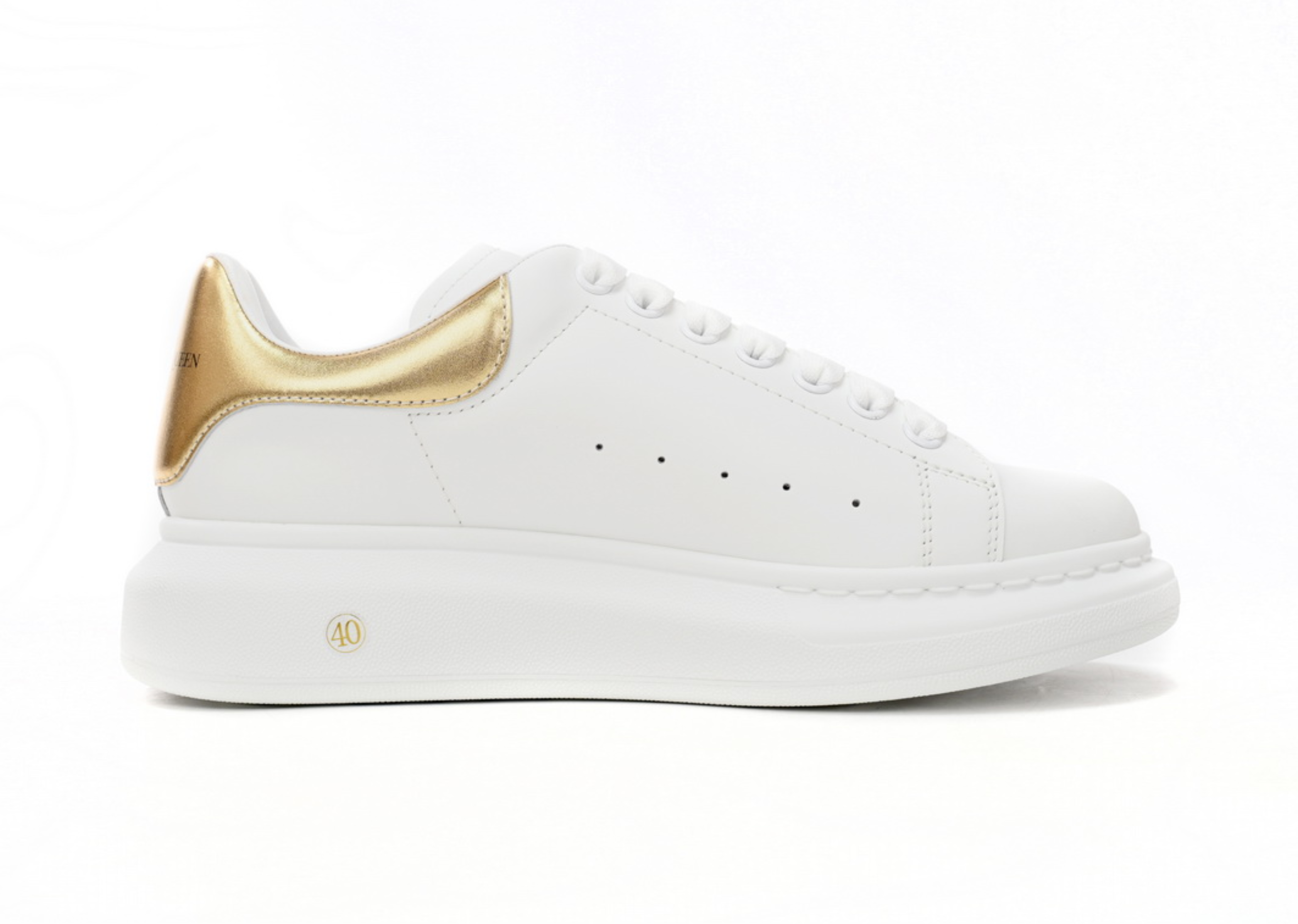 Alexander McQueen överdimensionerad sneaker gyllene svans