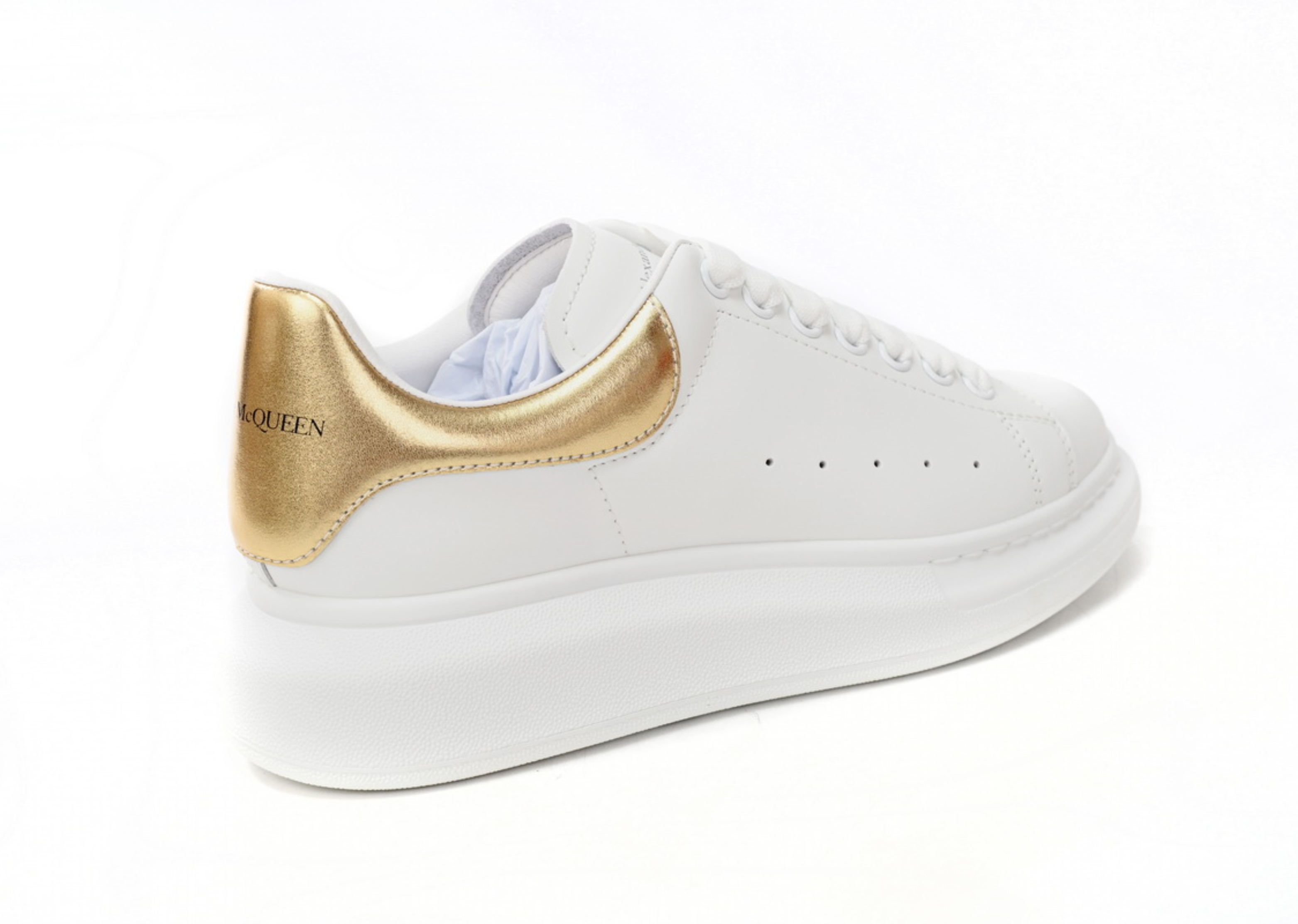 Alexander McQueen överdimensionerad sneaker gyllene svans